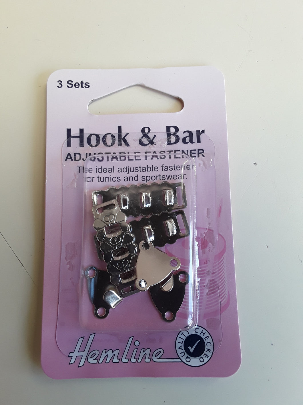 Hook and bar adjustable fastener